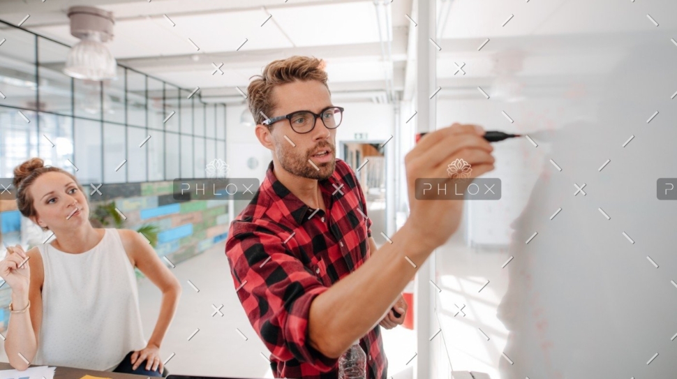 demo-attachment-289-casual-business-giving-a-presentation-to-PJKX6JZ